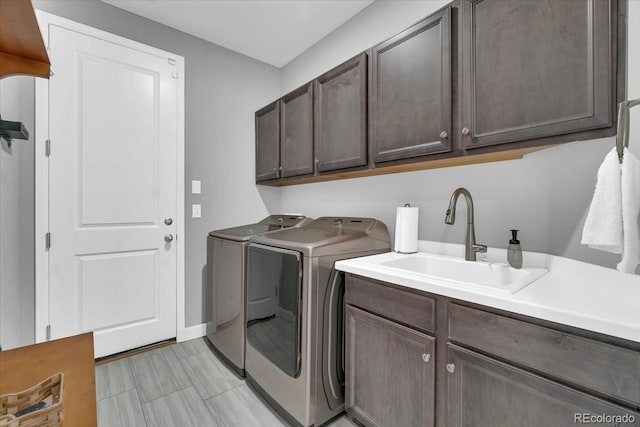 23913 E Swallow Cir, Aurora, CO 80016 - washroom with separate washer and dryer and cabinet space