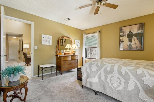 carpeted bedroom with a ceiling fan and baseboards