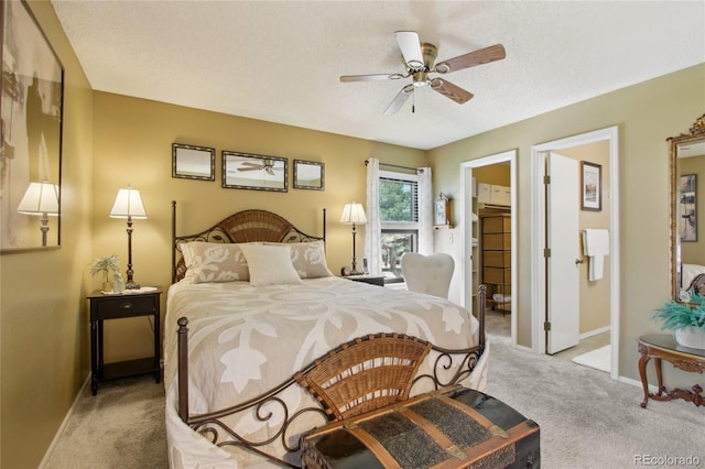 carpeted bedroom with baseboards, a textured ceiling, and a ceiling fan