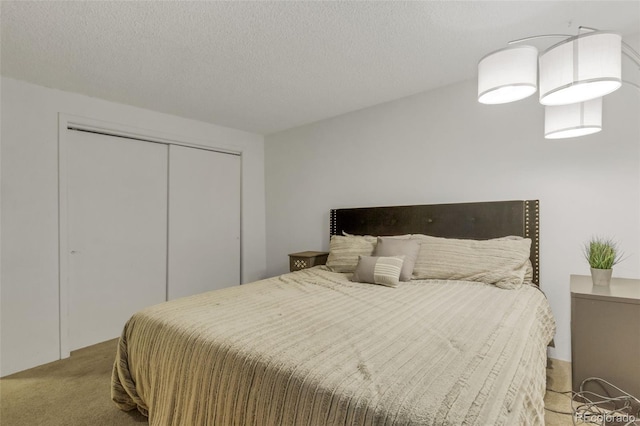 1611 Garfield Ave Unit 2, Louisville, CO 80027 - carpeted bedroom with a closet and a textured ceiling