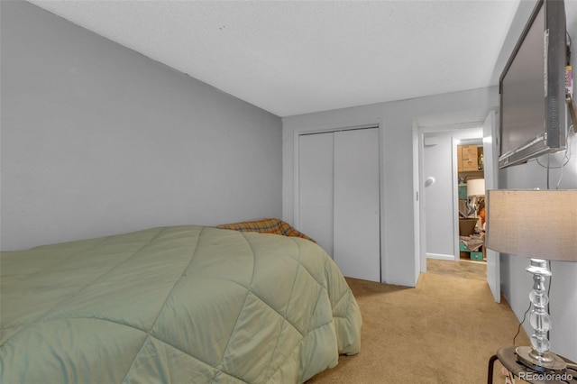 1611 Garfield Ave Unit 2, Louisville, CO 80027 - bedroom featuring light colored carpet and a closet