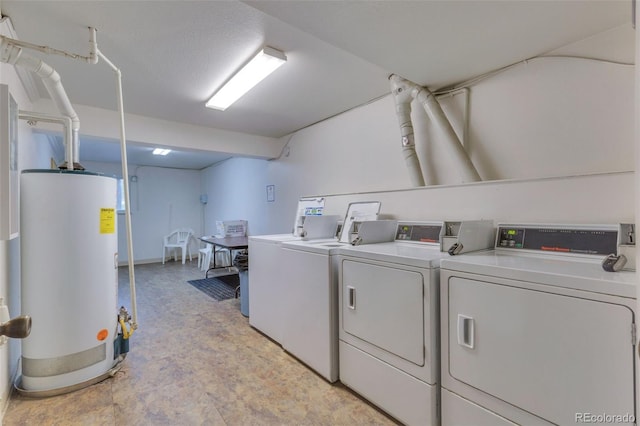 1611 Garfield Ave Unit 2, Louisville, CO 80027 - communal laundry room featuring washing machine and clothes dryer and water heater