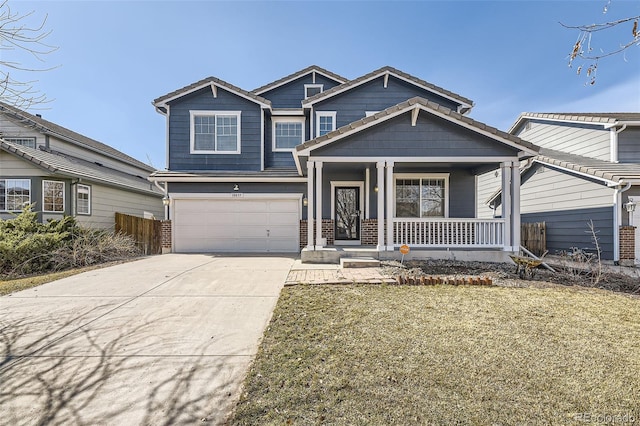 craftsman house featuring a garage, a front lawn, a porch, and driveway