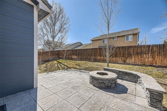 view of patio / terrace featuring a fire pit and a fenced backyard