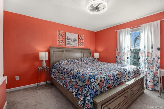 carpeted bedroom featuring baseboards