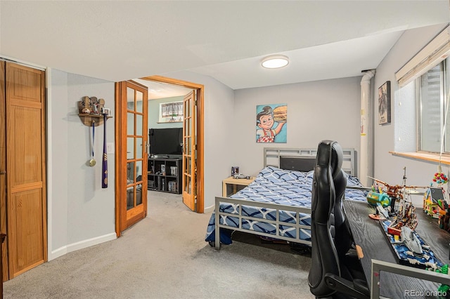 bedroom with carpet and baseboards