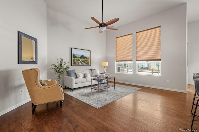 living room with ceiling fan and hardwood / wood-style floors