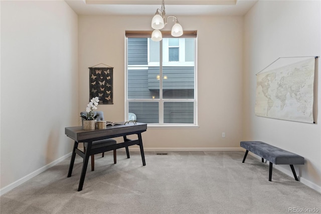 office featuring light colored carpet and a chandelier