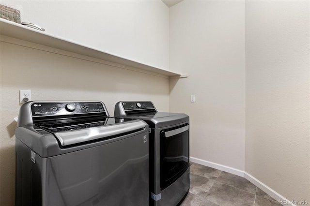 laundry room featuring washing machine and clothes dryer