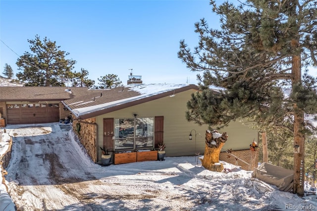 single story home featuring a garage