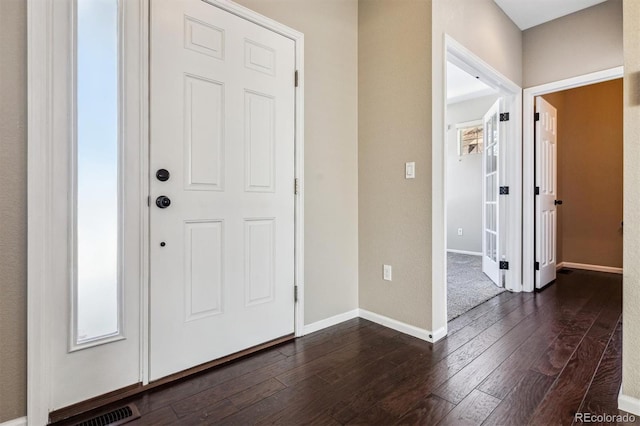 foyer with dark hardwood / wood-style flooring