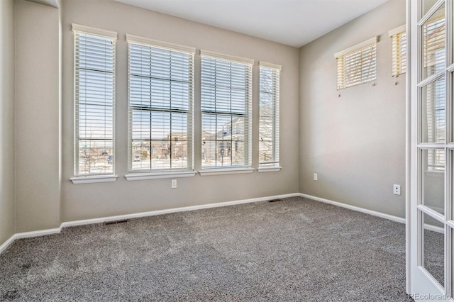 empty room featuring carpet floors