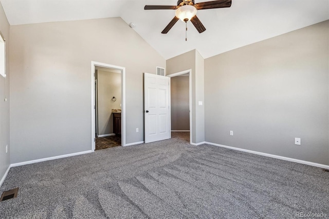 unfurnished bedroom with connected bathroom, dark carpet, high vaulted ceiling, and ceiling fan