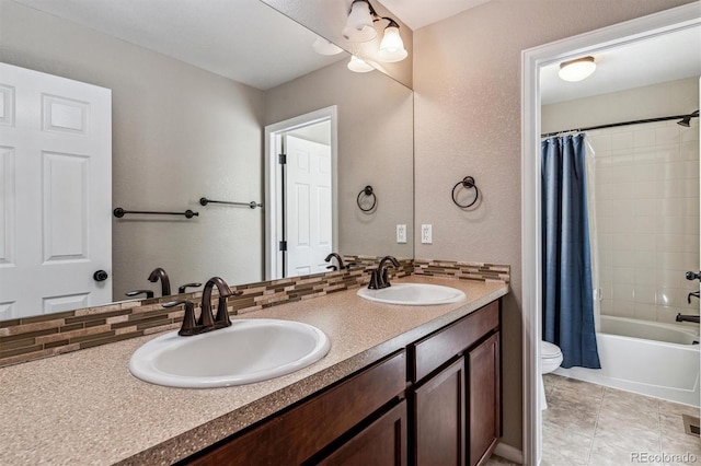 full bathroom featuring shower / bath combo, vanity, tile patterned floors, and toilet