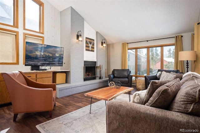 living room with a fireplace, high vaulted ceiling, and dark wood-type flooring