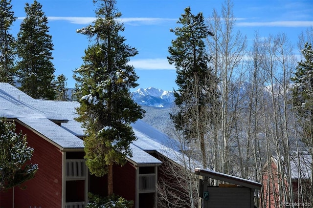 view of side of home featuring a mountain view