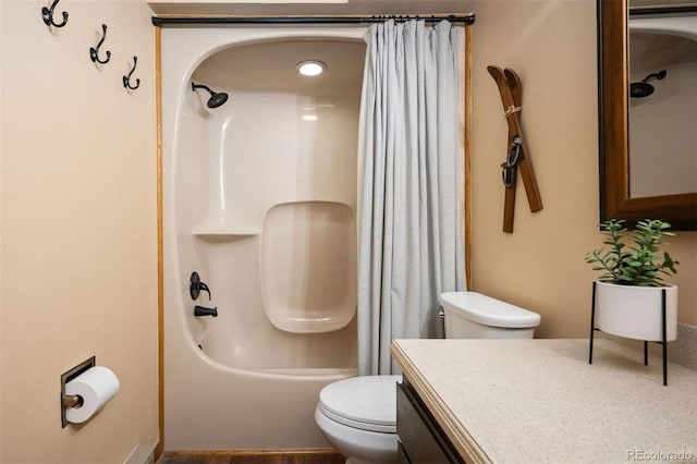 full bathroom featuring shower / tub combo with curtain, vanity, and toilet