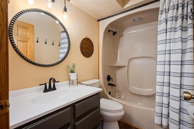 full bathroom featuring vanity, shower / tub combo, and toilet