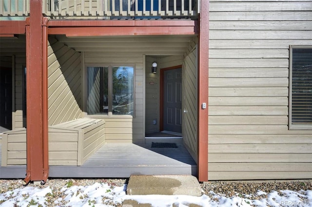 view of snow covered property entrance