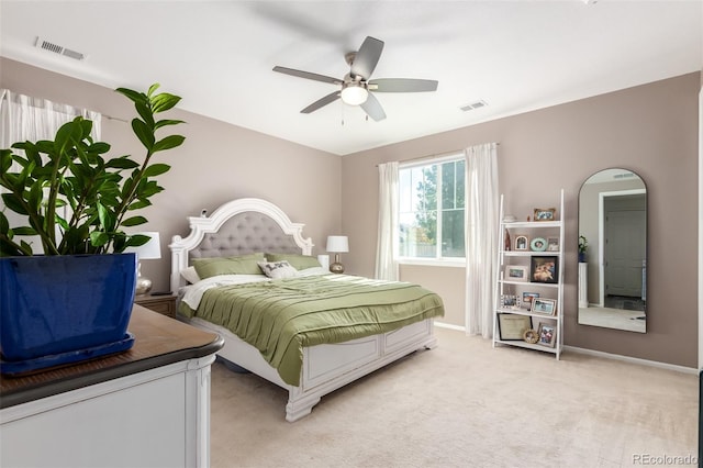 bedroom with light colored carpet and ceiling fan