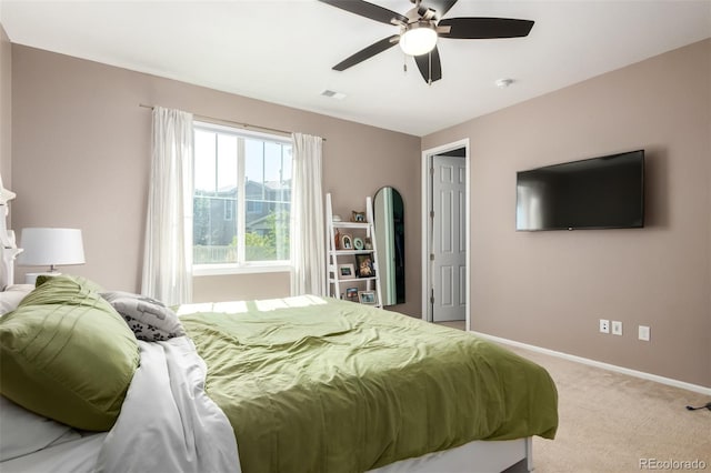 carpeted bedroom featuring ceiling fan