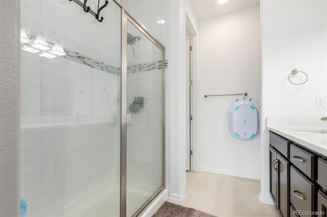 bathroom featuring vanity and an enclosed shower