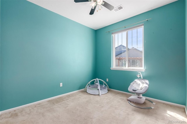 miscellaneous room featuring ceiling fan and carpet floors