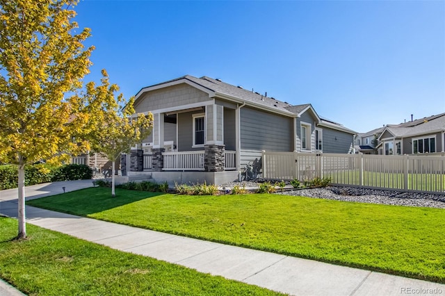 view of front of property with a porch and a front yard