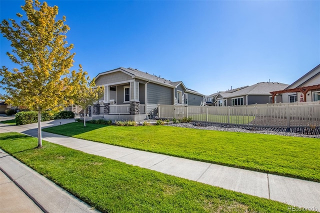 view of front of house with a porch and a front lawn