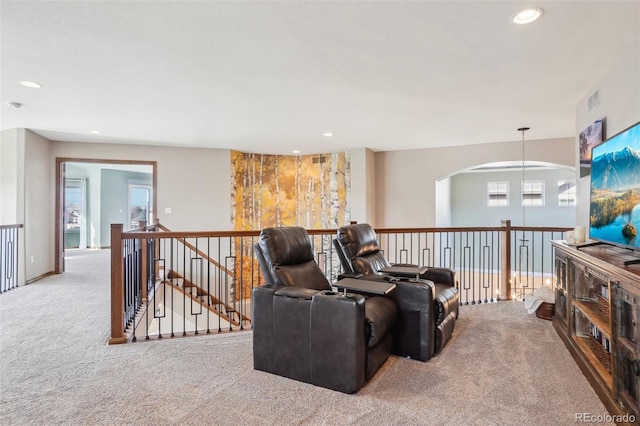 living room featuring carpet flooring, visible vents, and recessed lighting