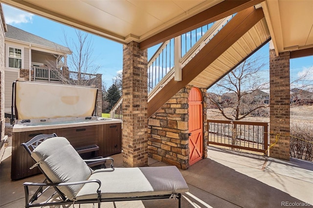 view of patio / terrace featuring a hot tub