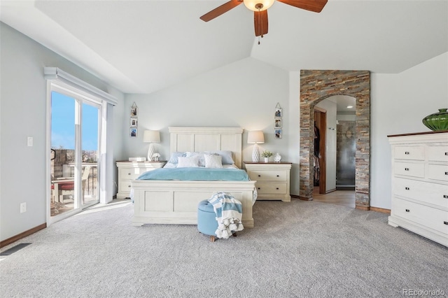 bedroom featuring visible vents, arched walkways, access to exterior, vaulted ceiling, and carpet flooring