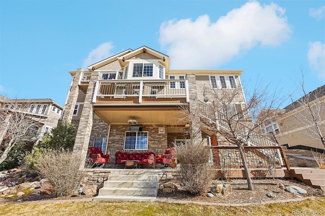 view of front of house with a porch and a balcony