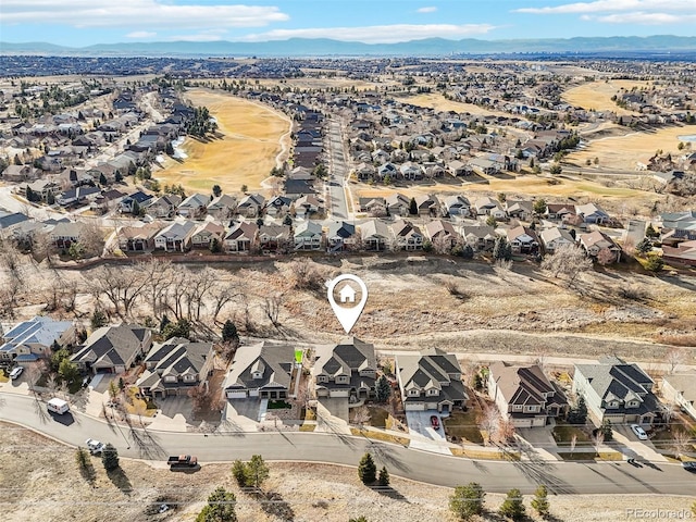 birds eye view of property with a residential view