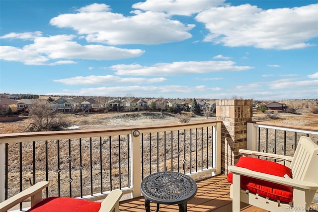 wooden deck featuring a residential view