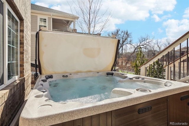 exterior space featuring a hot tub