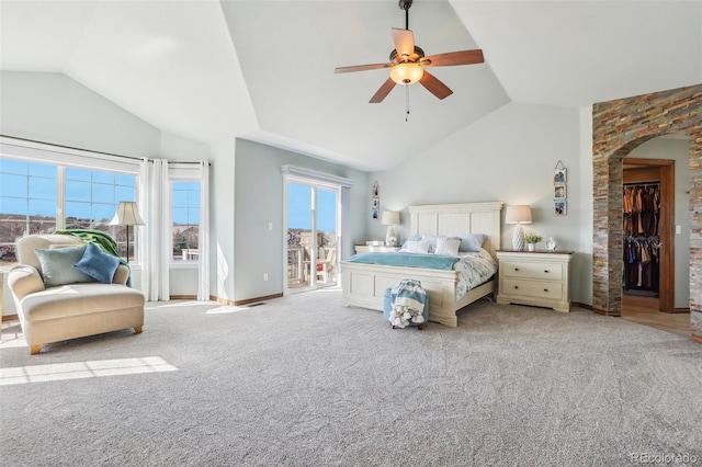 8131 S Coolidge Way, Aurora, CO 80016 - carpeted bedroom featuring arched walkways, ceiling fan, access to outside, baseboards, and high vaulted ceiling