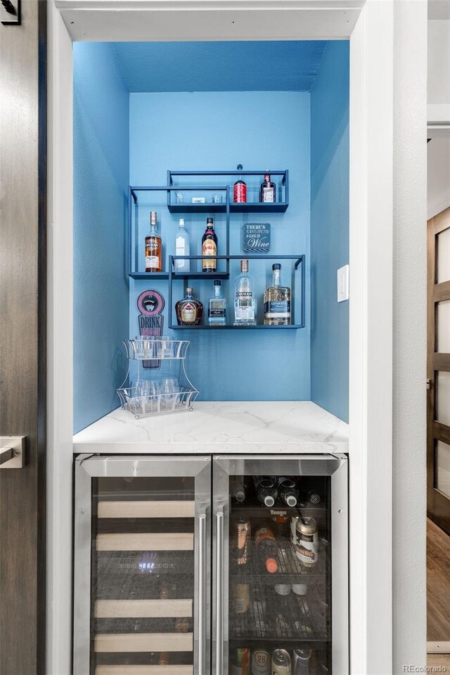 1551 Larimer St Unit 1405, Denver, CO 80202 - bar with beverage cooler and a dry bar