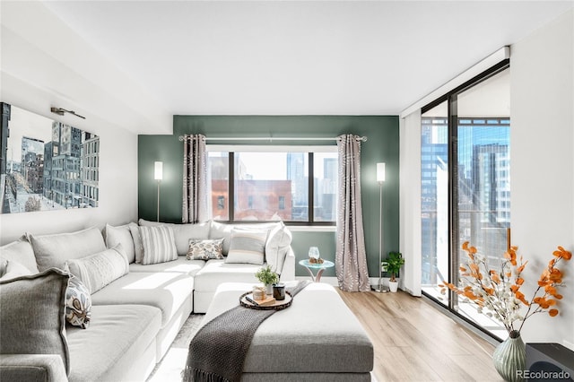 1551 Larimer St Unit 1405, Denver, CO 80202 - living room with floor to ceiling windows and light wood-style floors