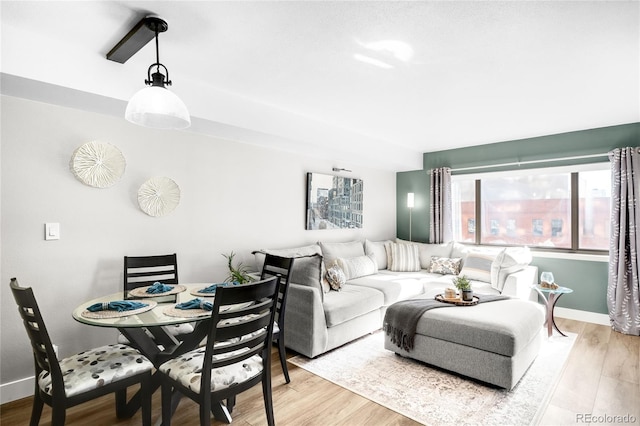 1551 Larimer St Unit 1405, Denver, CO 80202 - living room featuring light wood finished floors and baseboards