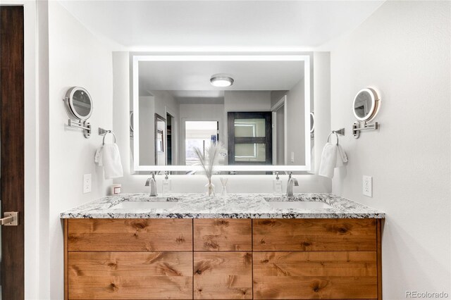 1551 Larimer St Unit 1405, Denver, CO 80202 - bathroom featuring double vanity and a sink