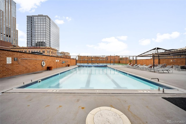 1551 Larimer St Unit 1405, Denver, CO 80202 - community pool with a patio area and fence