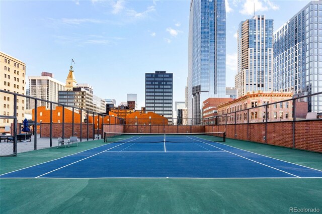 1551 Larimer St Unit 1405, Denver, CO 80202 - view of sport court featuring a view of city, community basketball court, and fence