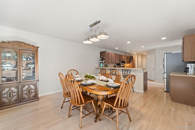 dining room featuring light hardwood / wood-style flooring