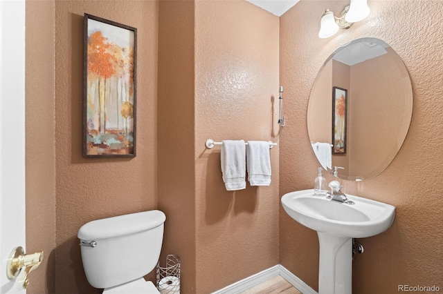 bathroom featuring toilet