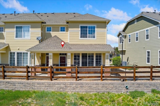 16212 E Geddes Ln Unit 11, Aurora, CO 80016 - back of property with fence, a shingled roof, and central AC unit