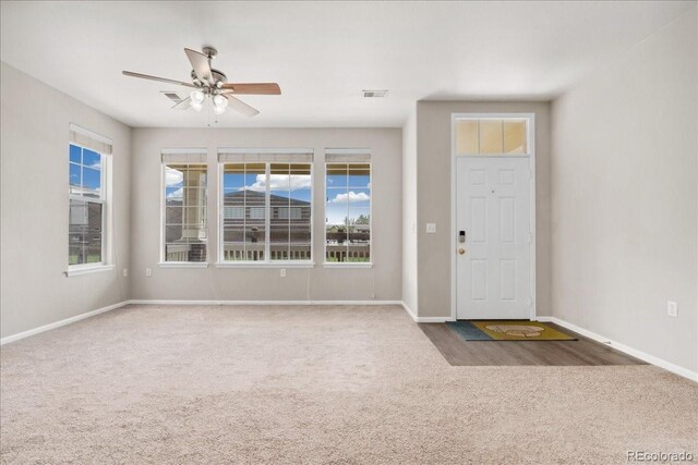16212 E Geddes Ln Unit 11, Aurora, CO 80016 - foyer featuring carpet flooring, a ceiling fan, baseboards, and healthy amount of natural light