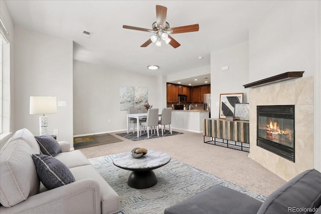 16212 E Geddes Ln Unit 11, Aurora, CO 80016 - living area featuring carpet floors, ceiling fan, and a tile fireplace