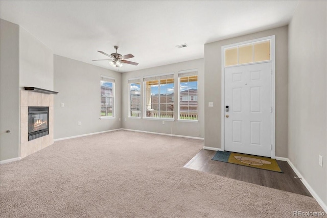16212 E Geddes Ln Unit 11, Aurora, CO 80016 - carpeted foyer featuring baseboards, ceiling fan, and a fireplace
