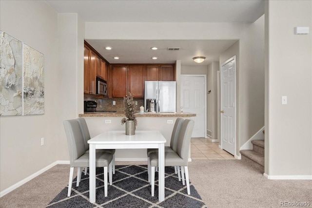 16212 E Geddes Ln Unit 11, Aurora, CO 80016 - dining room featuring light colored carpet, baseboards, stairway, and recessed lighting